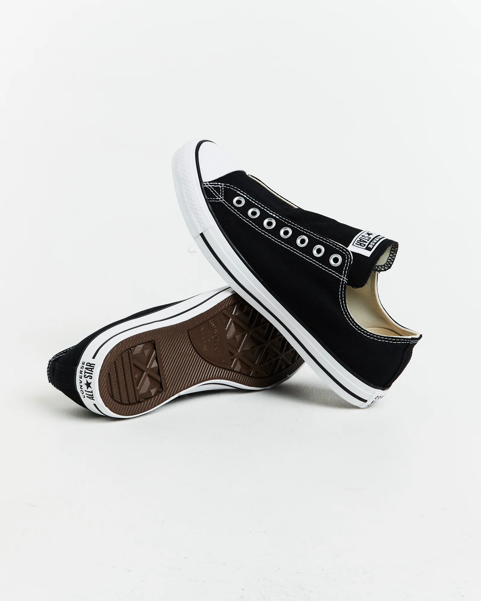 Chuck Taylor All Star Slip On Sneakers In Black/White - Image 7