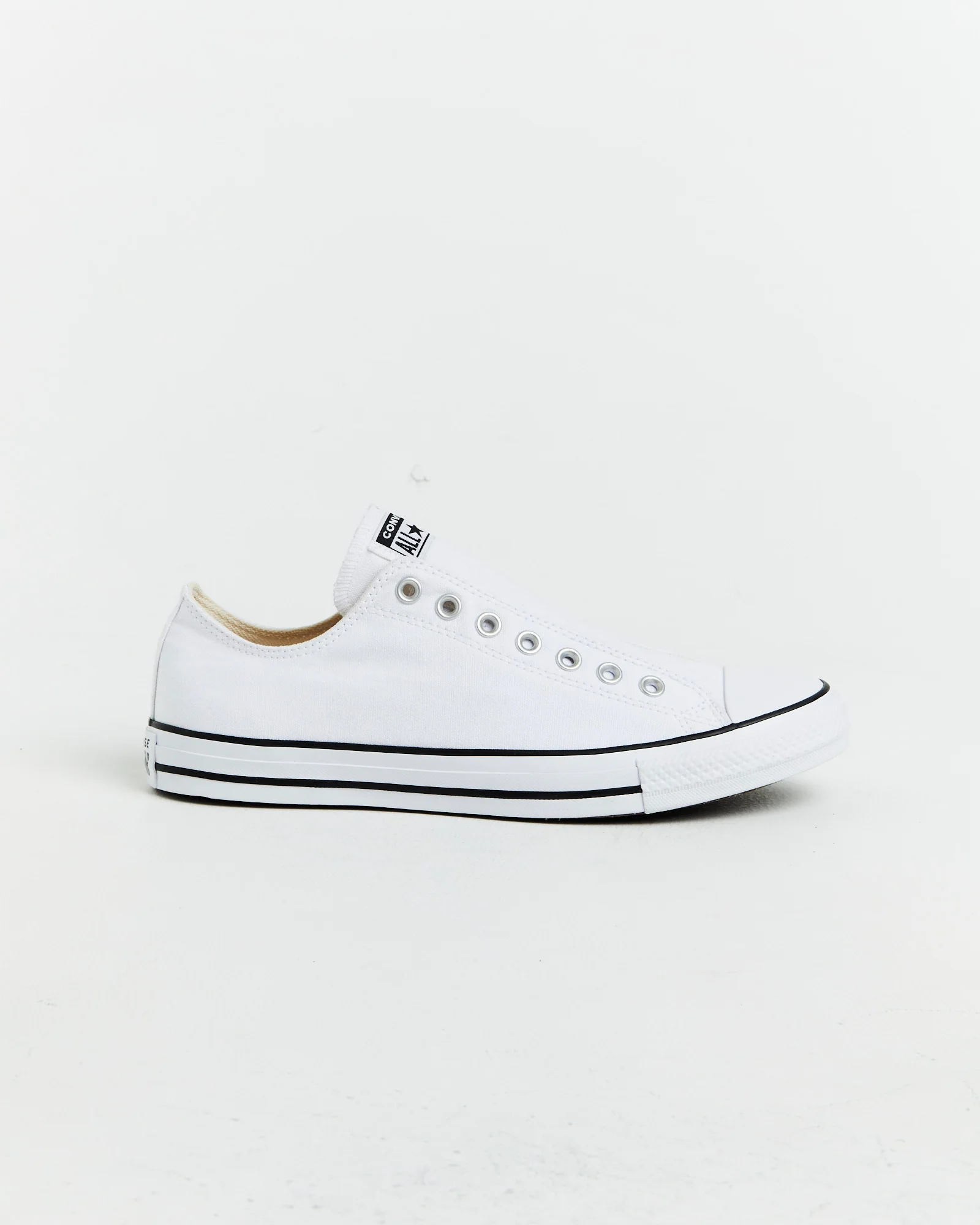 Chuck Taylor All Star Slip On Sneakers In White/Black - Image 3